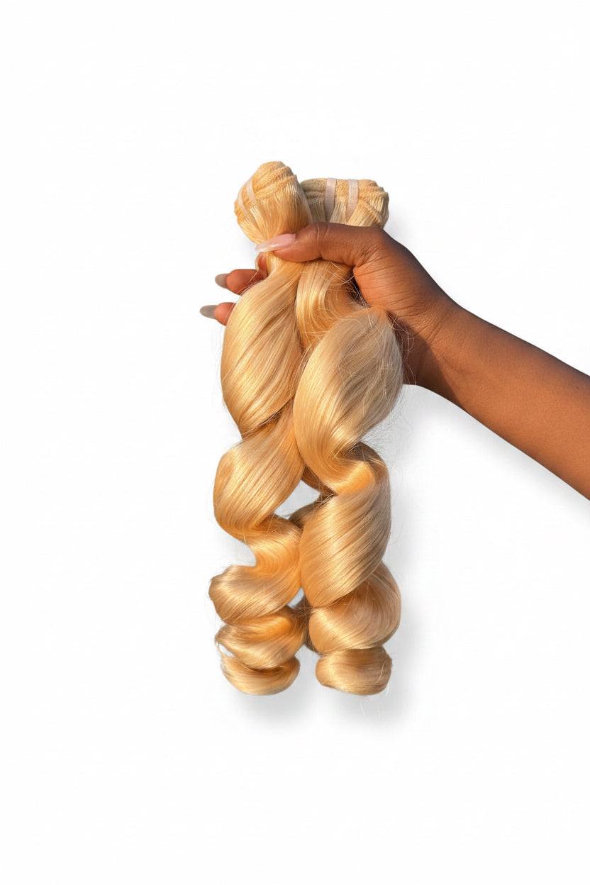 613 Blonde Loose Wave Bundles made from 100% premium human hair with soft, natural waves and high-bright blonde color