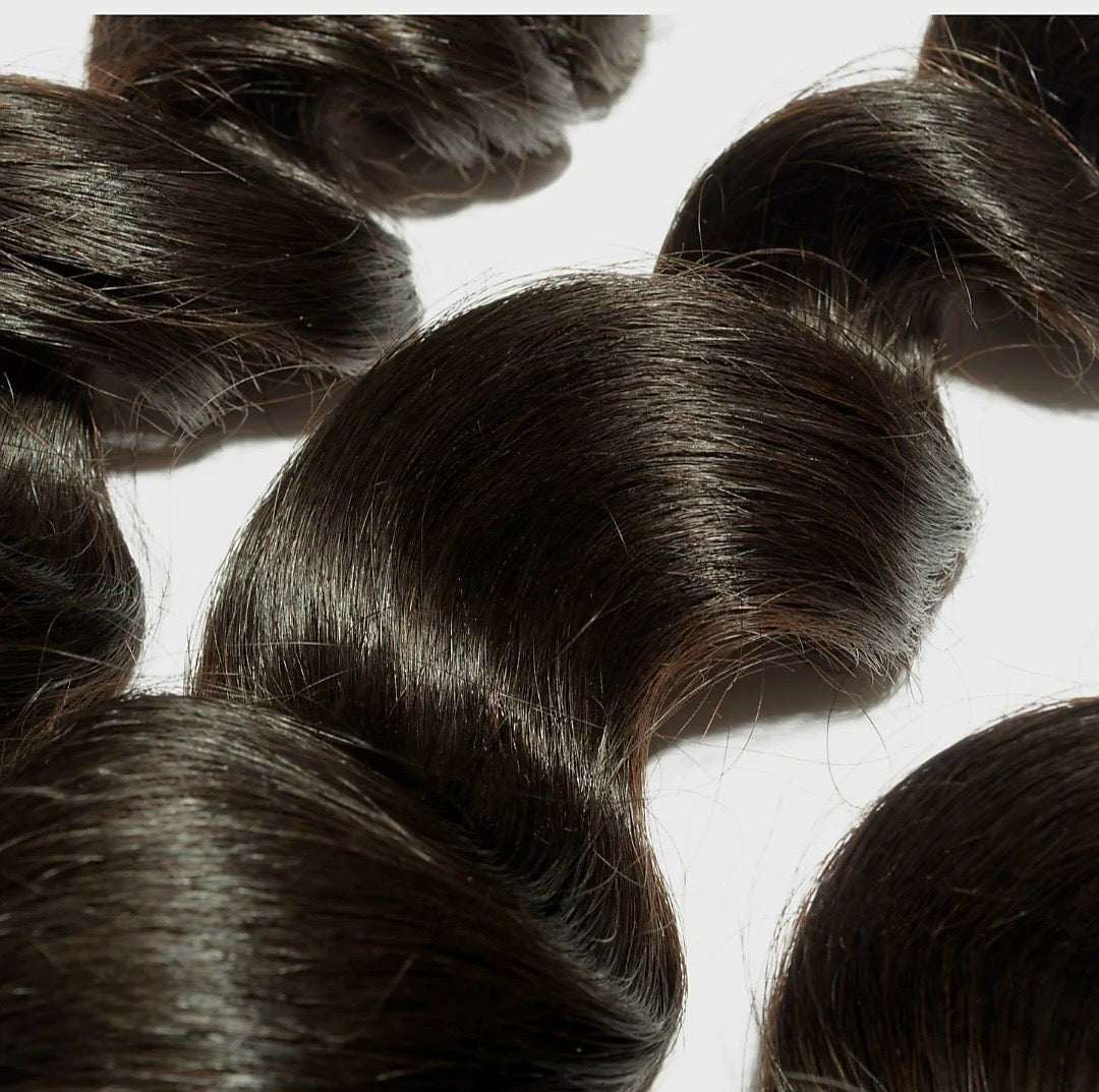 Malaysian Virgin Bundles loose wave hair extensions in natural color with soft texture and varying lengths