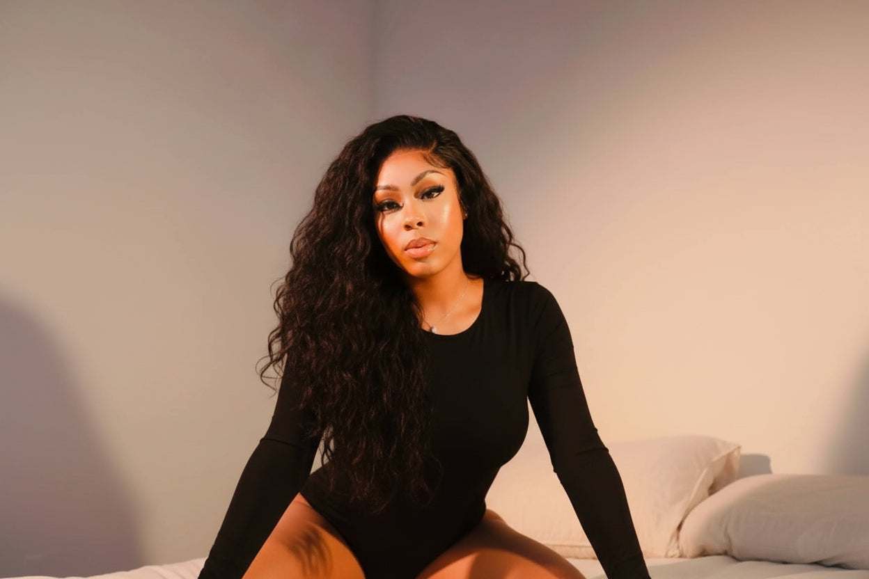 Premium Malaysian Deep Wave Hair Bundles with soft, voluminous, cascading waves in various lengths from 14” to 30” inches