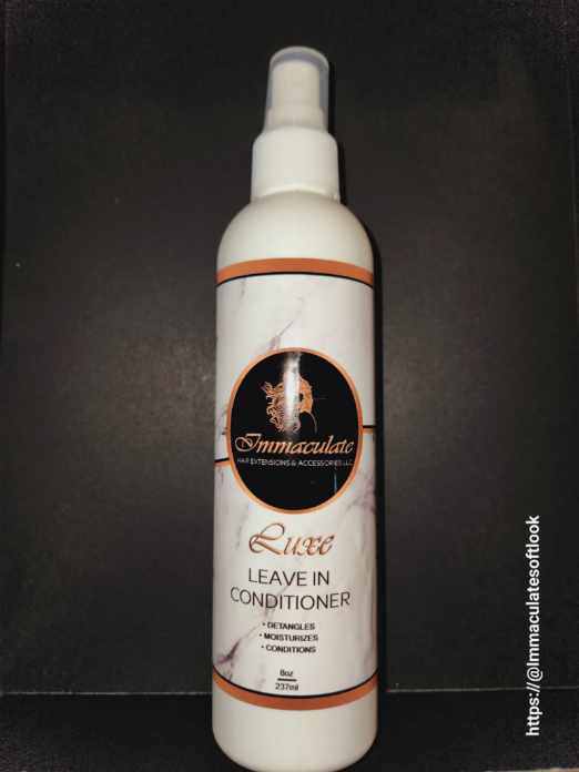 PURE ELEGANCE HAIR CARE leave-in conditioner bottle on a dark background.